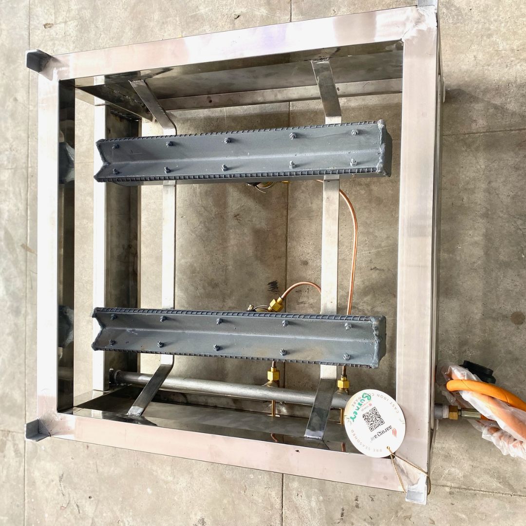 Metal frame structure with components on a concrete floor
