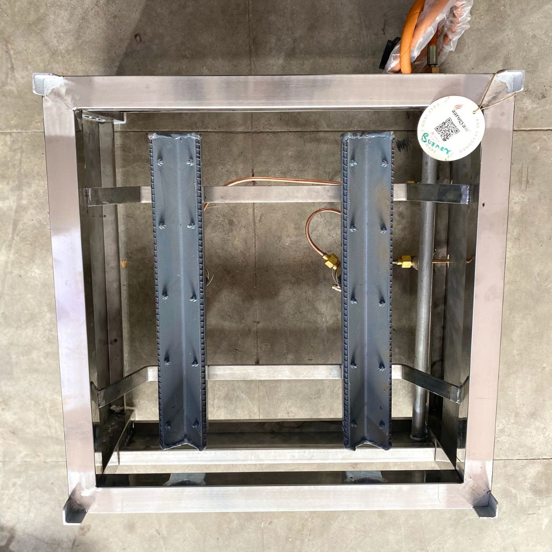 Metal frame structure with glass panels on a concrete floor