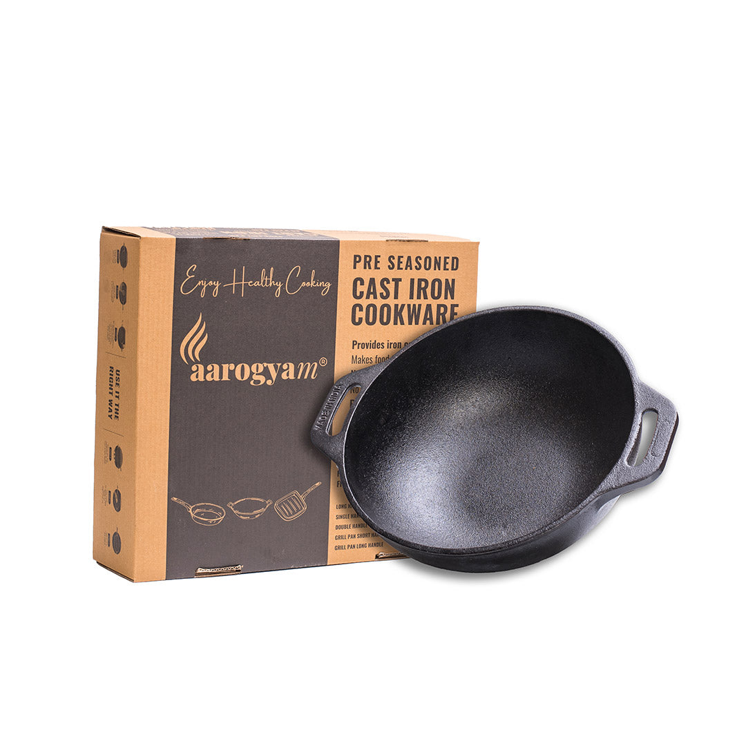 Cast iron cookware with aarogyam packaging on a white background
