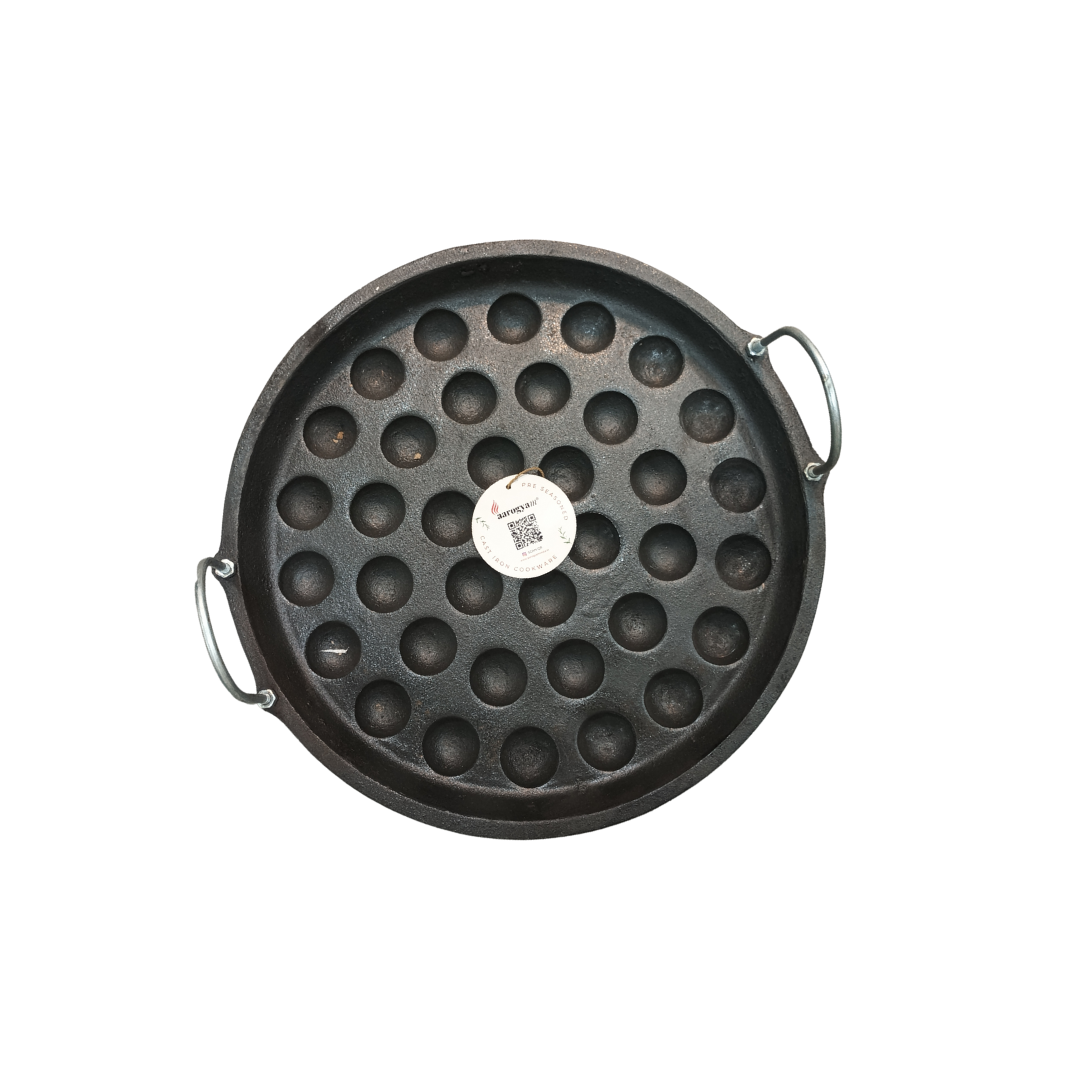 Black round waffle maker with handle on a white background