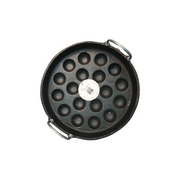 Black round waffle maker with multiple holes on a white background