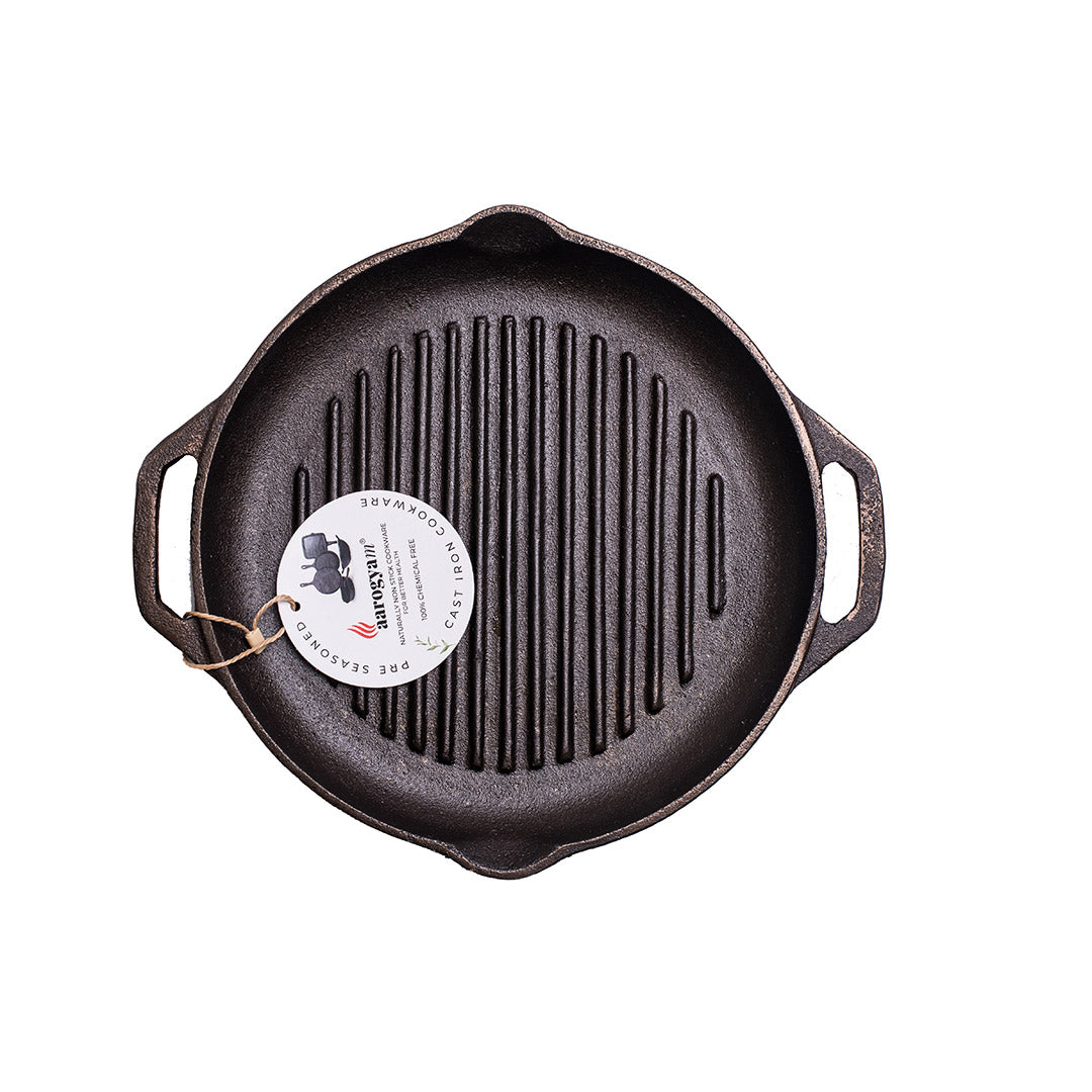 Cast iron skillet with a brand label on a white background
