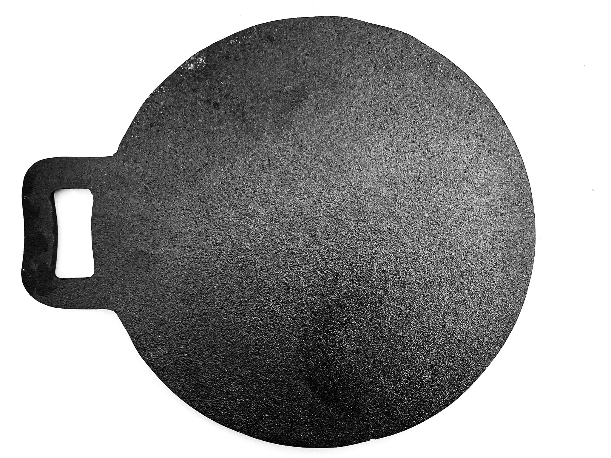 Round black stone with a handle on a white background