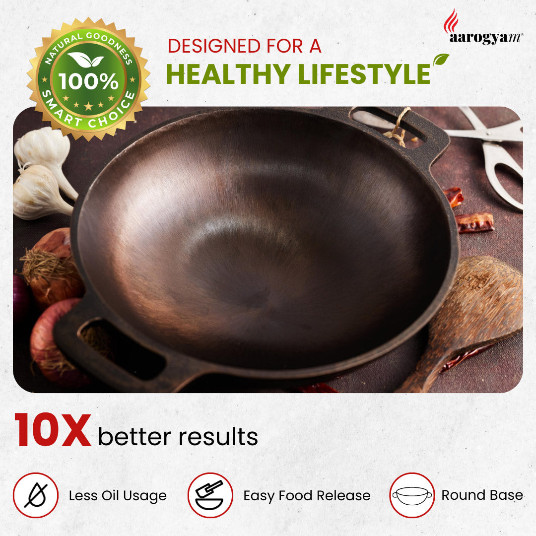 Cast iron wok with cooking ingredients on a wooden surface, featuring Aarogya brand.