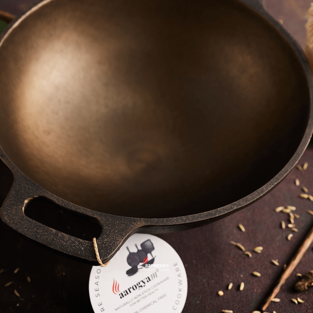 Cast iron skillet with a label on a dark surface