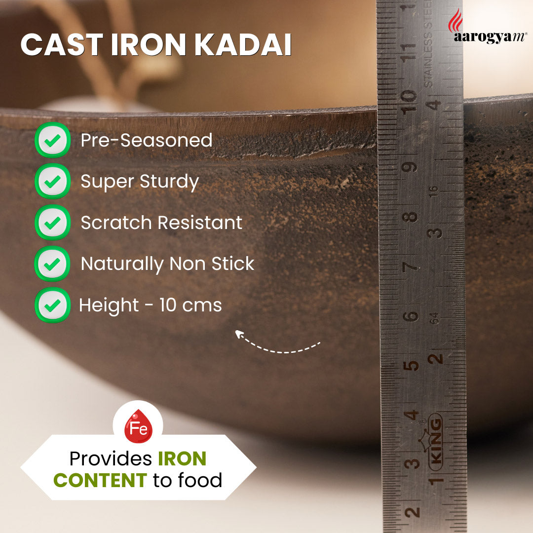 Cast iron kadai with measurement ruler and feature list on a beige background