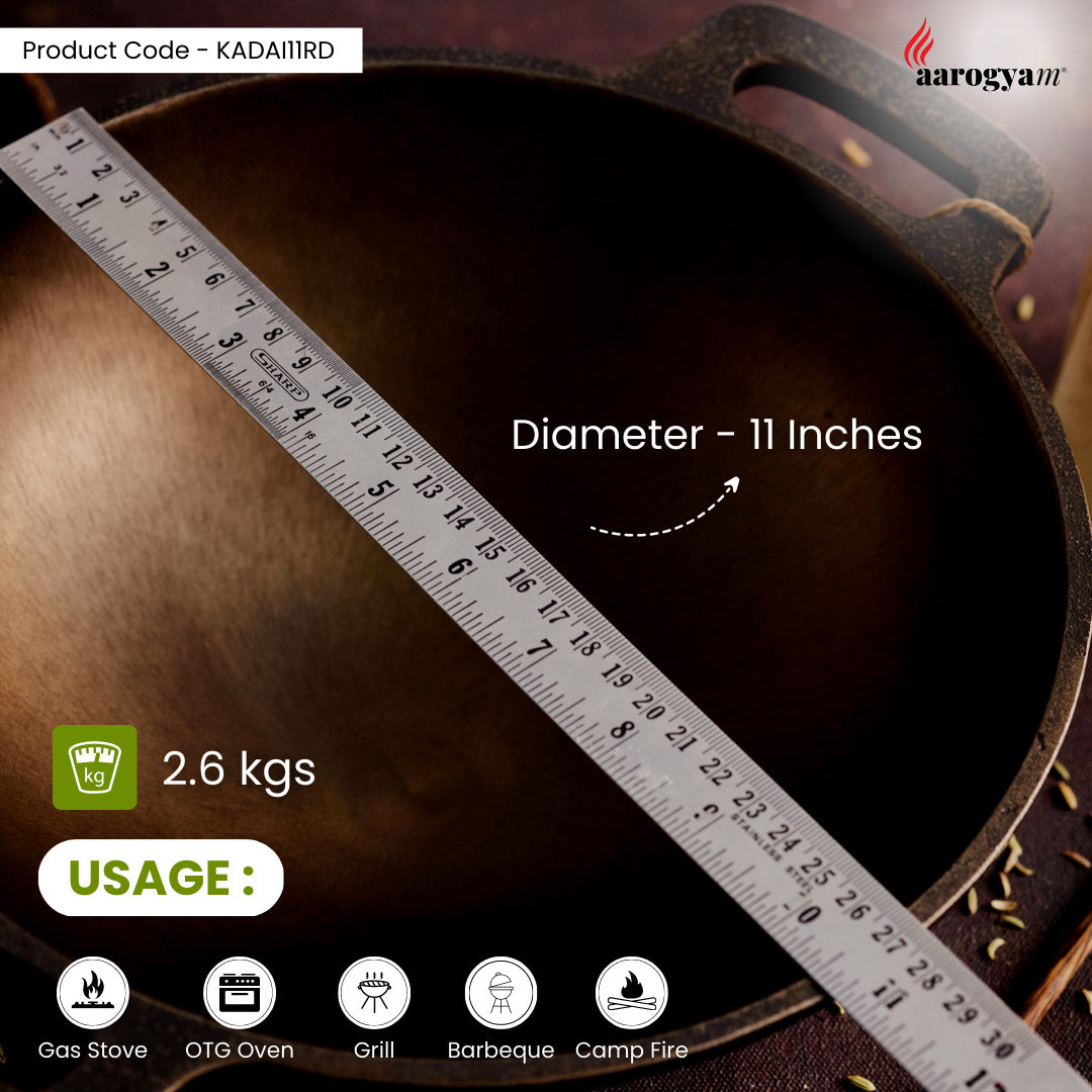Cast iron skillet with a ruler showing its diameter, brand 'aarogyan' visible