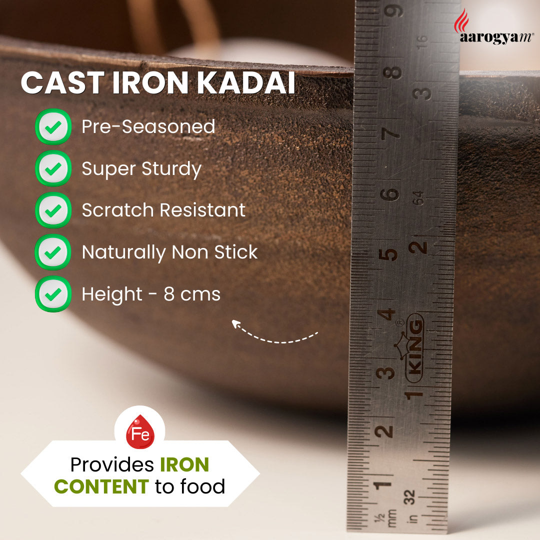 Cast iron kadai with measurement details and a ruler for scale.