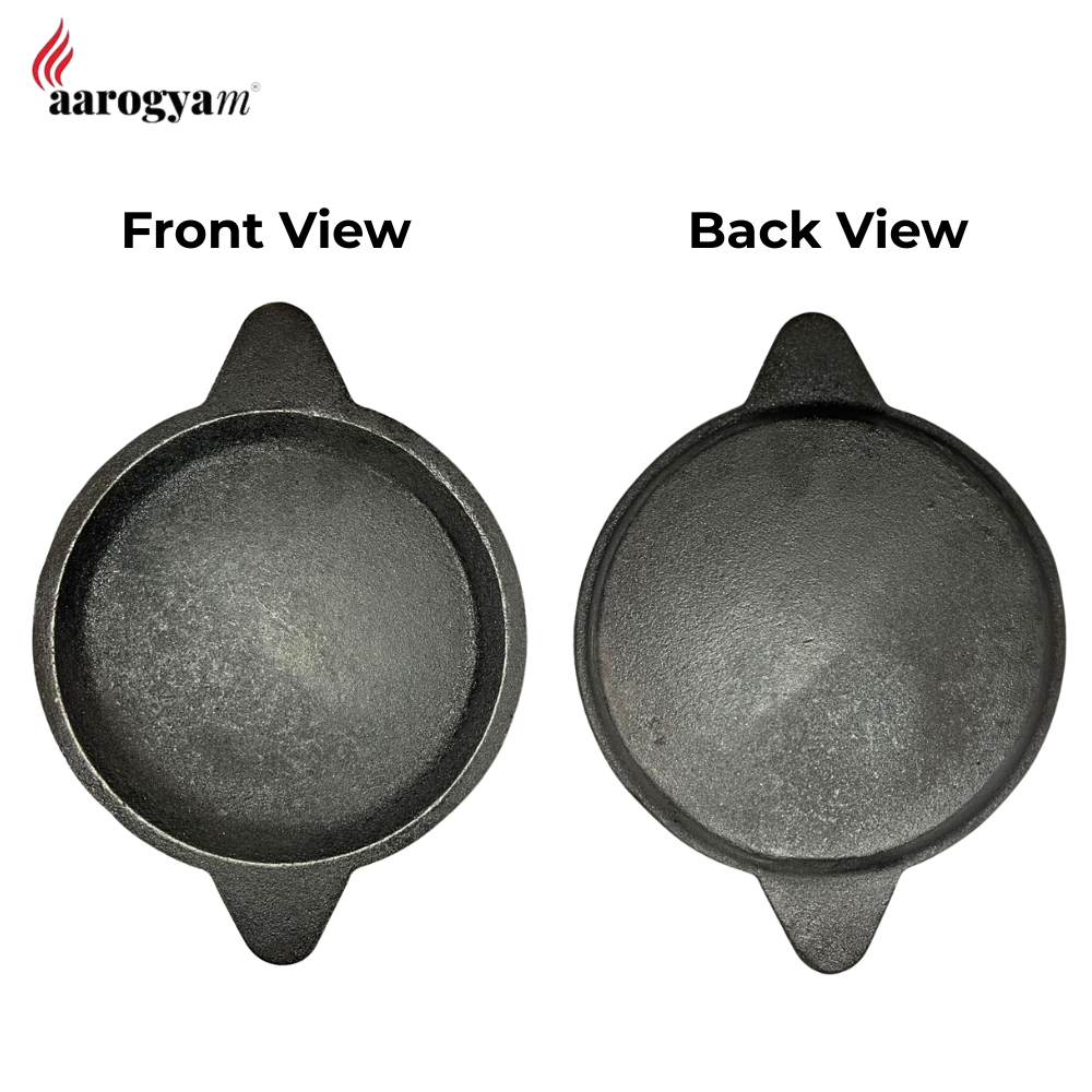 Two views of a black cast iron skillet with 'aarogya' branding.