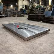 Large metal platform in a warehouse with 'aarogya' branding.