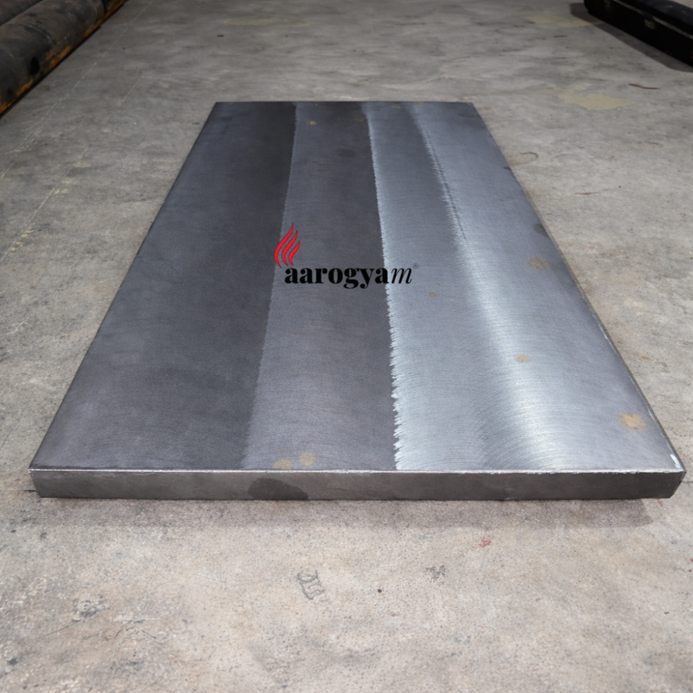 Metallic plate with a brand logo on a concrete floor