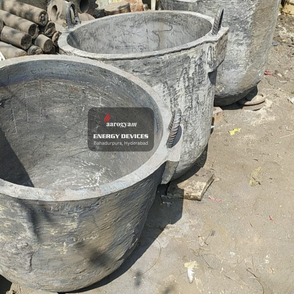 Large stone pots with 'aarogya' energy devices label on a concrete surface