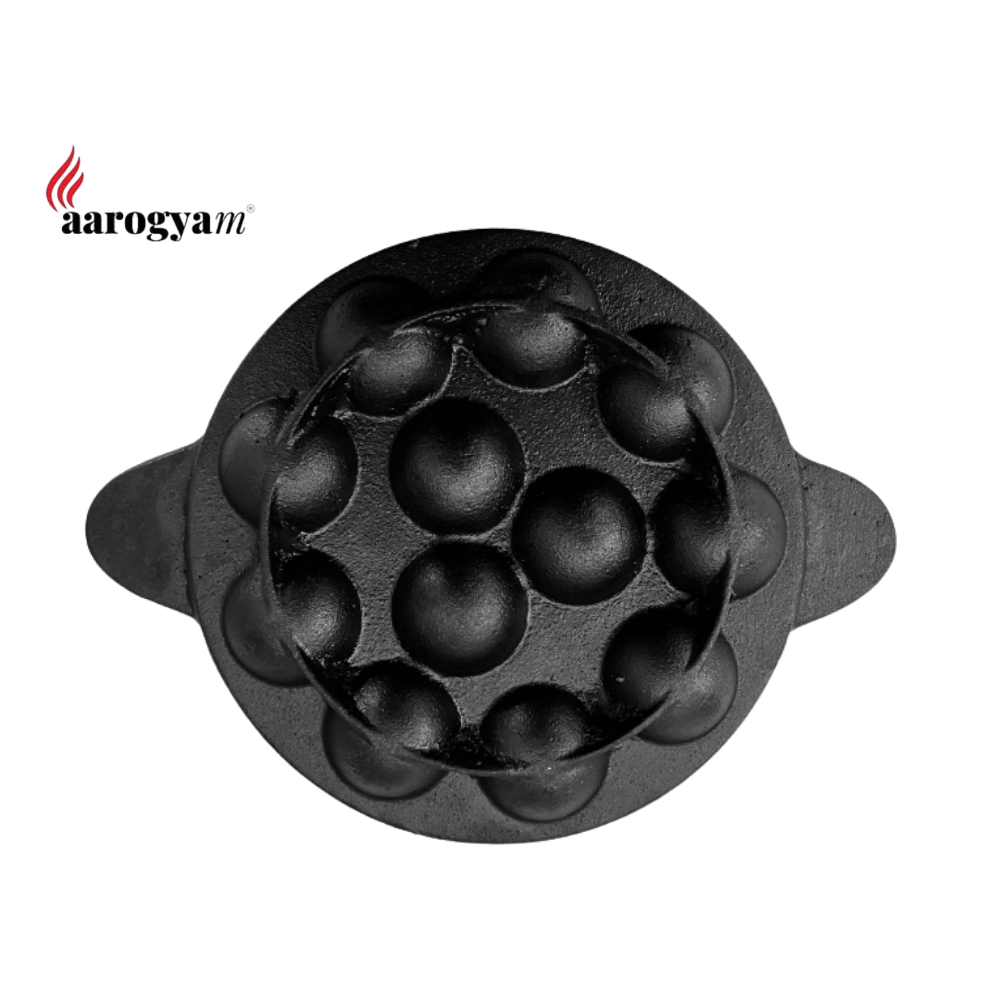 Black silicone mold with spherical shapes on a white background, branded 'aarogyam'.