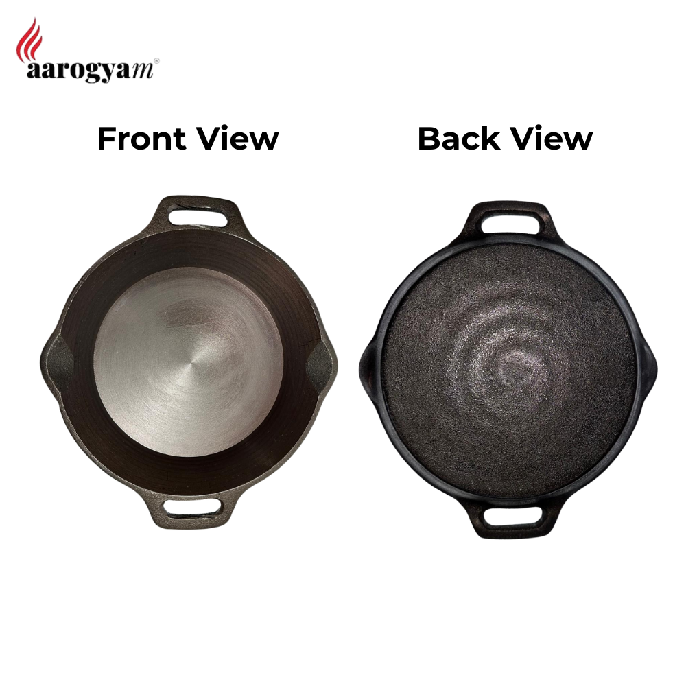 Black cast iron skillet shown from front and back views on a white background with 'aarogyam' branding.