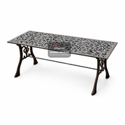 Decorative metal table with intricate patterns on a white background