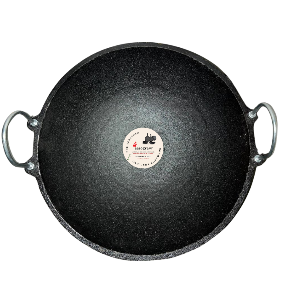 Black cast iron skillet with a brand label on a white background