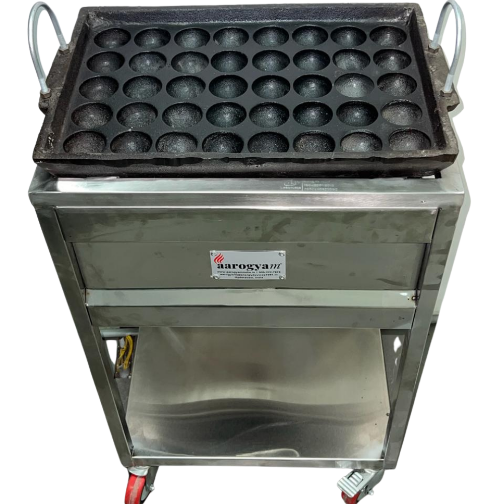 Stainless steel waffle maker with round molds on a white background