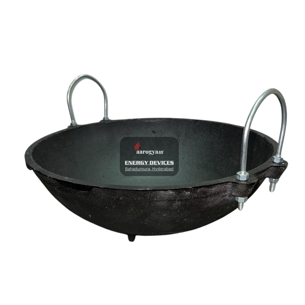 Black cast iron kadai with handles on a white background