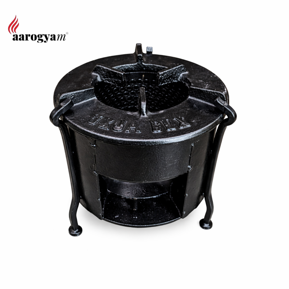 Black metal stove with 'aarogyam' branding on a white background