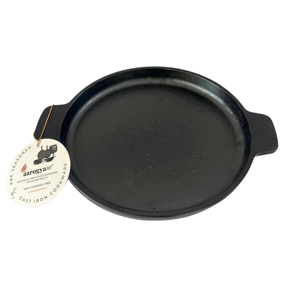 Black cast iron skillet with a brand tag on a white background