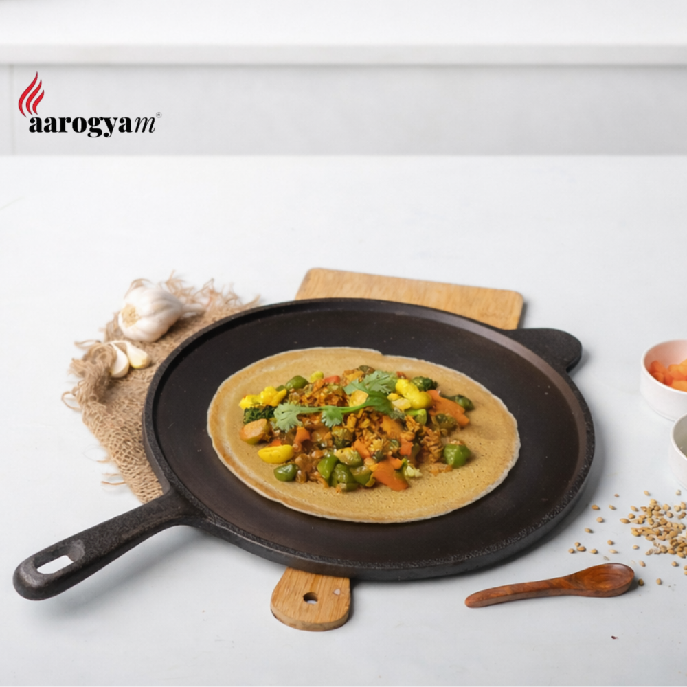 Vegetable omelette on a pan with 'aarogya' branding in the corner.