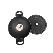 Black cast iron wok with lid on a white background