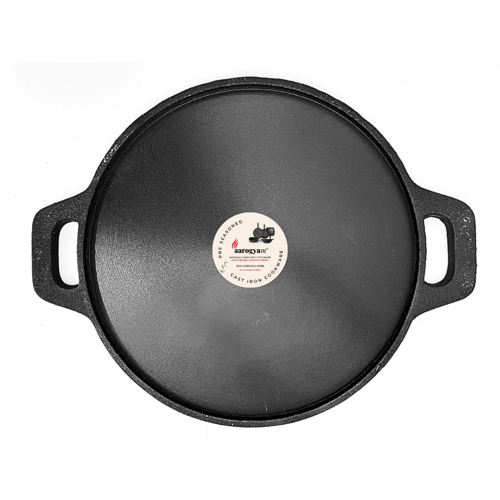 Black cast iron skillet with a label on a white background