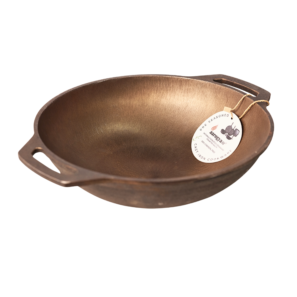 Bronze wok with a tag on a white background