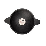 Black cast iron skillet with a brand label on a white background
