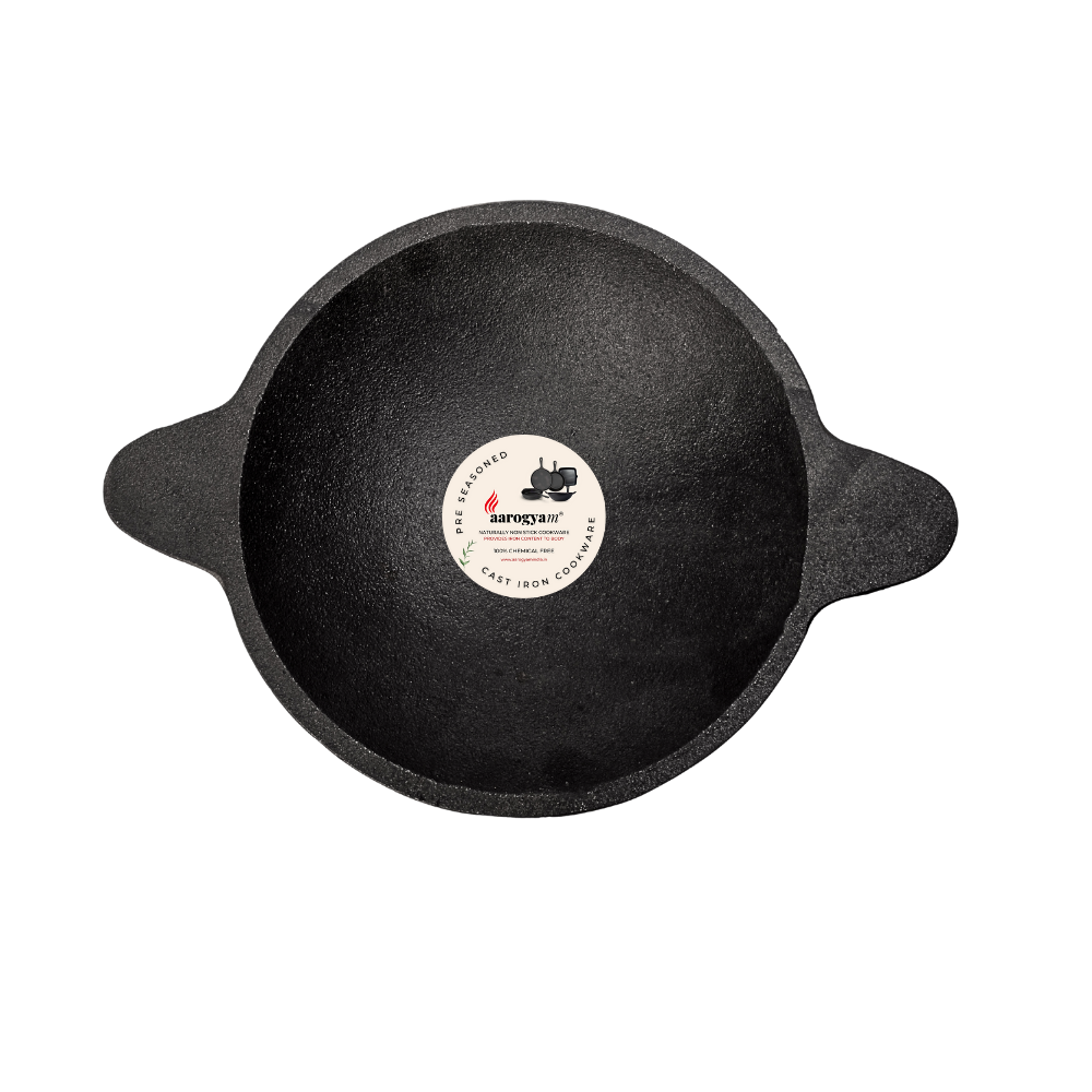 Black cast iron skillet with a brand label on a white background