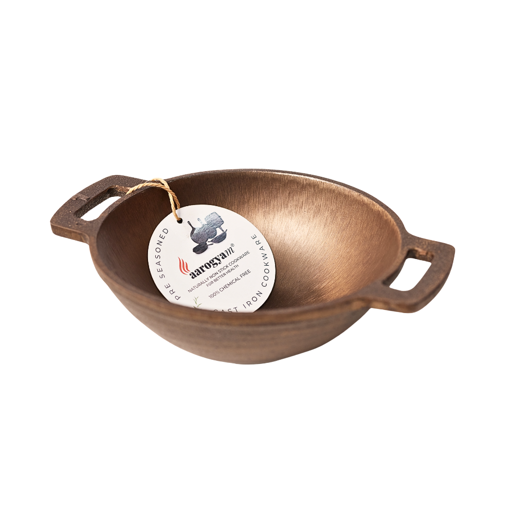 Bronze bowl with handles and a tag on a white background