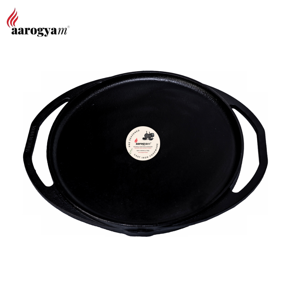 Black cast iron skillet with a brand label on a white background