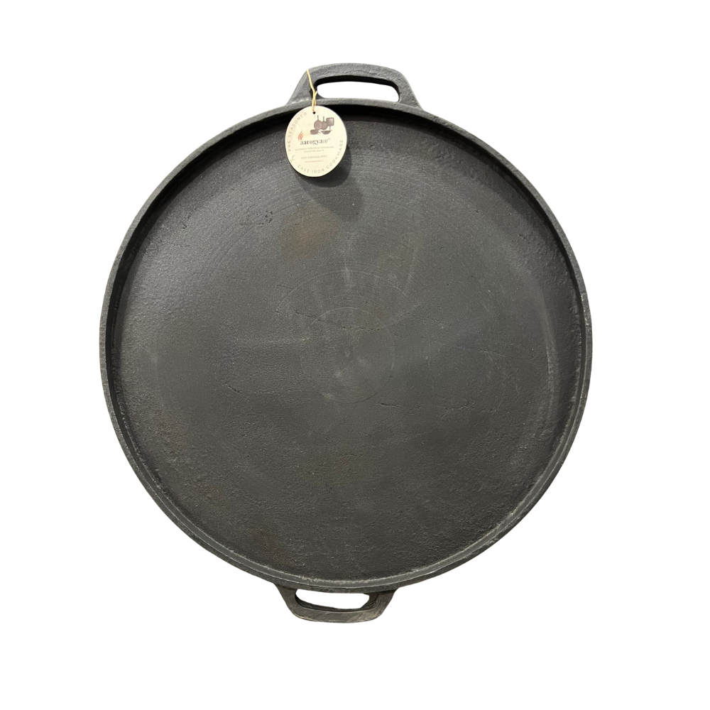 Cast iron skillet with a handle on a white background
