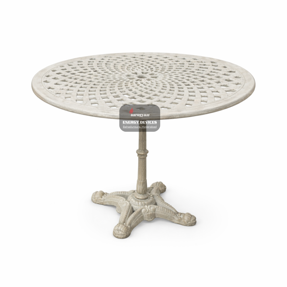 Round metal table with decorative design on a white background