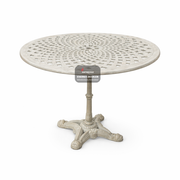 Round metal table with decorative design on a white background