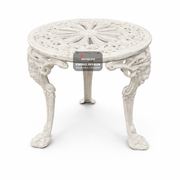 Decorative white table with intricate design on a white background