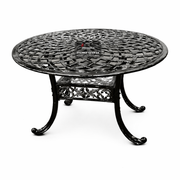 Decorative black metal table on a white background