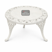 White ornate table with a brand label on a white background