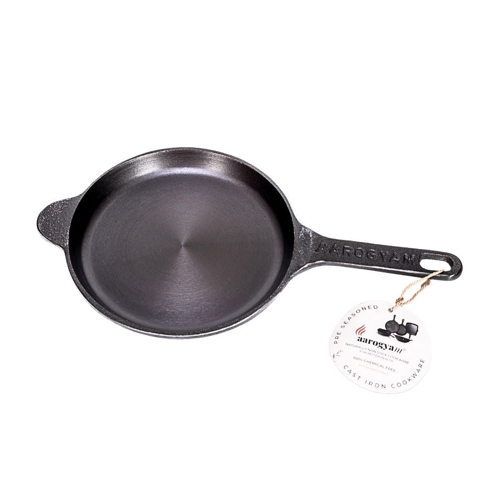 Cast iron skillet with a brand label on a white background
