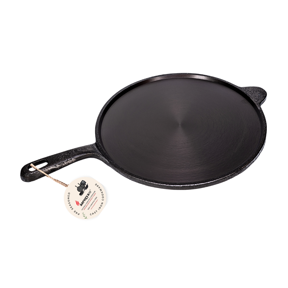 Black cast iron skillet on a white background