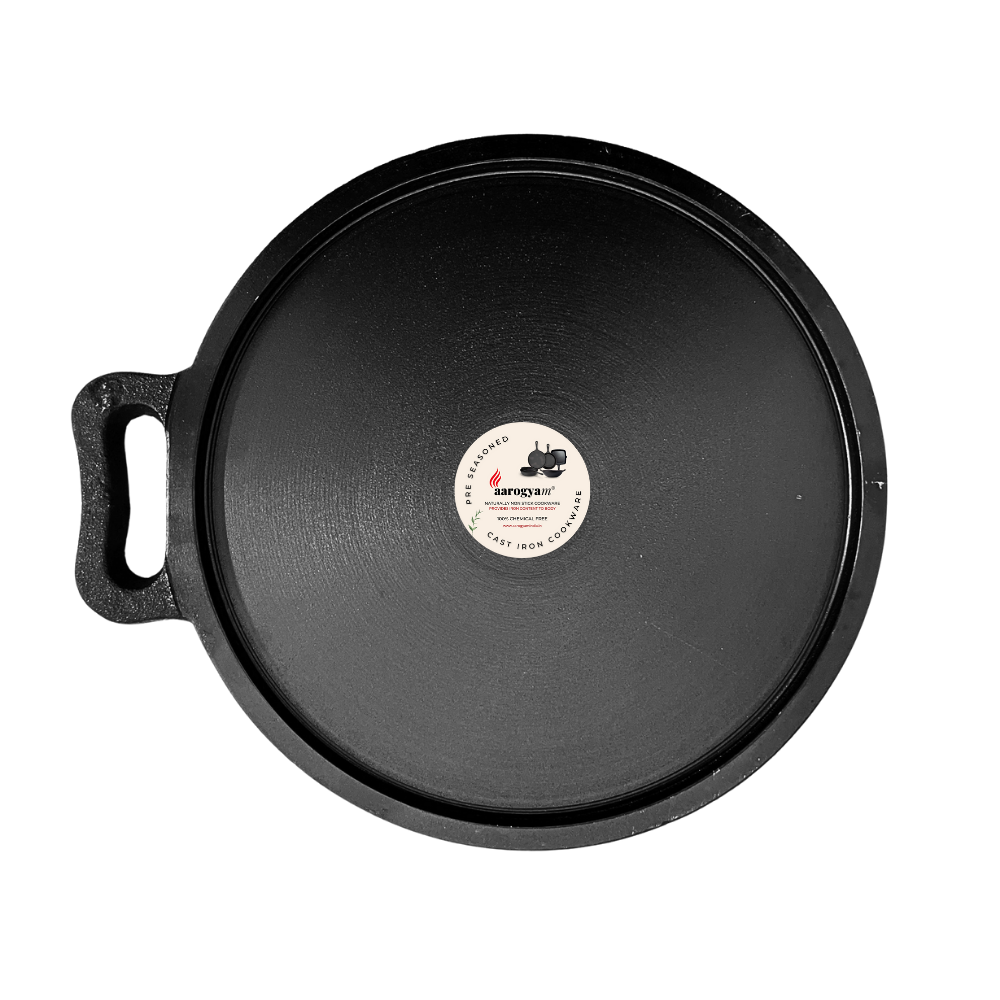 Black cast iron skillet with a brand label on a white background
