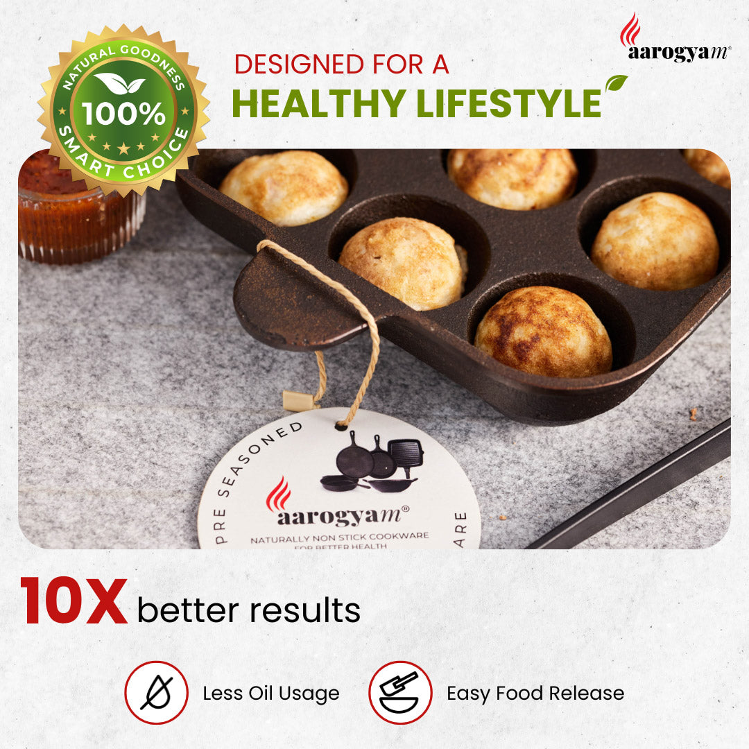 Muffin tin with baked goods on a gray surface, featuring Aarogyan cookware branding.