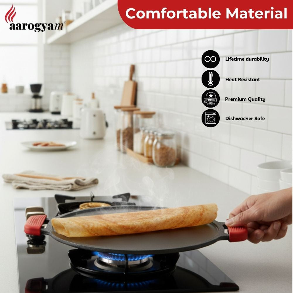 Person cooking on a gas stove with a pan, kitchen setting, Aarogyam brand visible