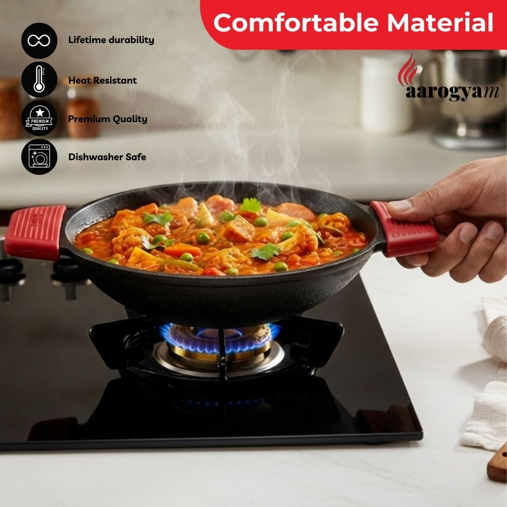 Person holding a frying pan with food on a stove, featuring Aarogyam brand.