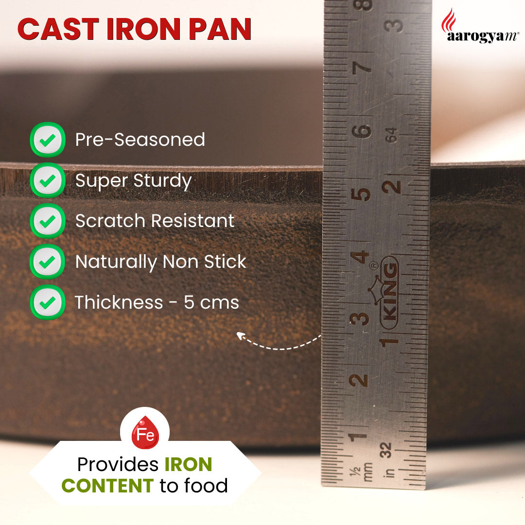 Cast iron pan with measurement ruler and features listed, brand 'Aarogya' visible