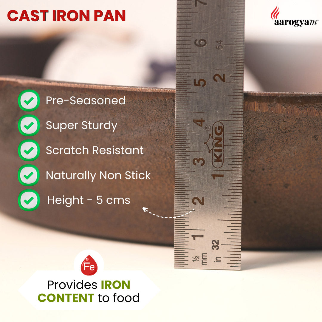 Cast iron pan with measurement details and Aarogyam brand logo.