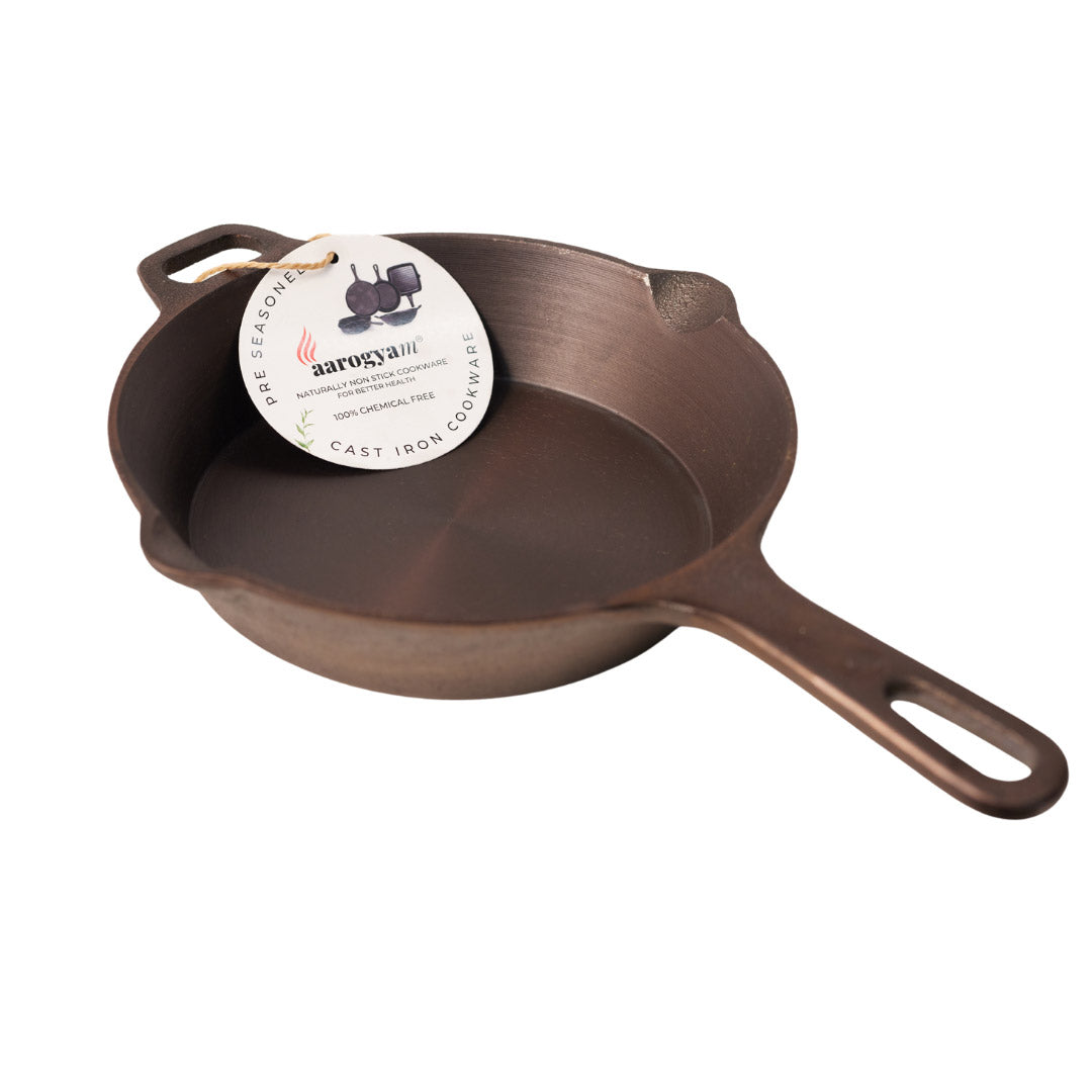 Cast iron skillet with a brand label on a white background