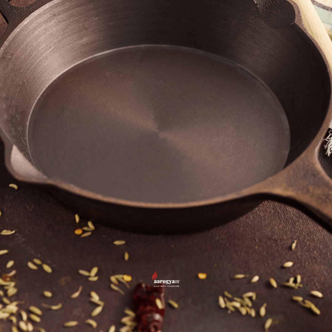 Close-up of a cast iron pot with spices on a dark surface