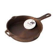 Cast iron skillet with a label on a white background