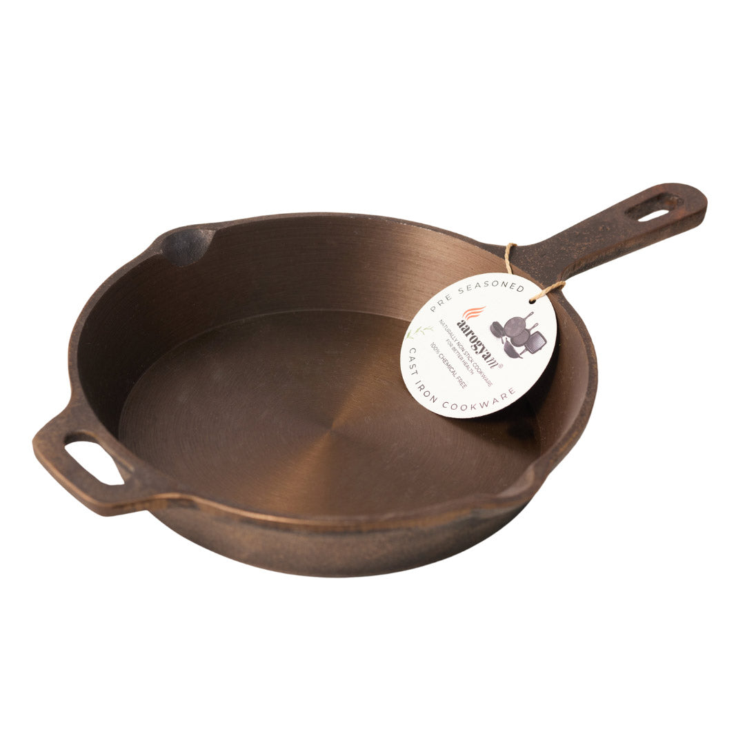 Cast iron skillet with a brand tag on a white background